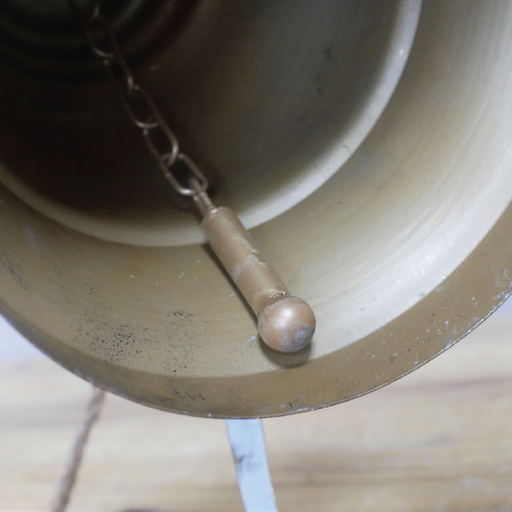 Ornamental bell adorned with a ribbon, dimensions 26cm H x 18cm W x 18cm D, lightweight at 0.42kg.