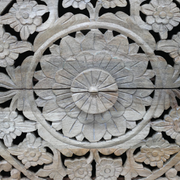 Stylish bedside cabinet featuring carved details, two drawers, and a cut-out pattern, dimensions 61cm H x 52cm W x 41cm D, weight 15.6kg.