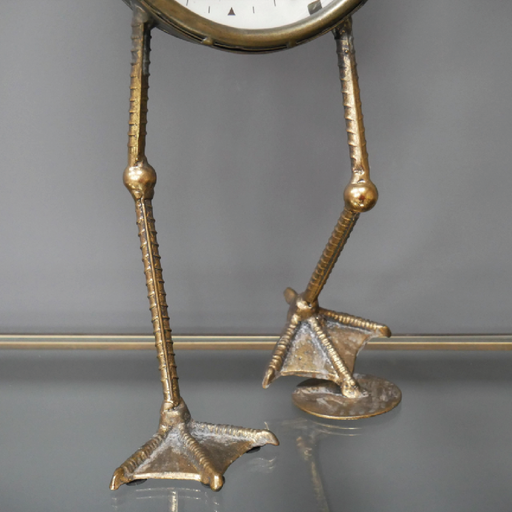 Whimsical tabletop clock featuring decorative bird feet, dimensions 53cm H x 21cm W x 15cm D, weight 1.65kg.