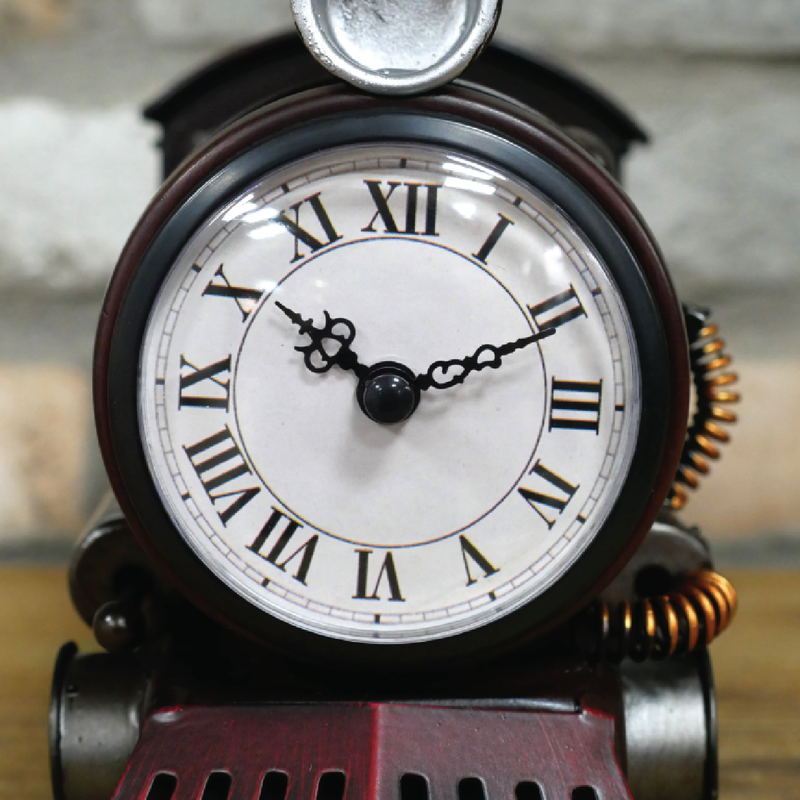 Whimsical tabletop clock modeled after a steam locomotive with snow plough attachment, 26cm wide by 17cm high by 11cm deep, 0.8kg in weight.