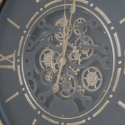 Black dial wall clock with visible gear mechanisms, industrial design, 88cm tall, 74cm wide, 9cm deep, 7.3kg in weight.