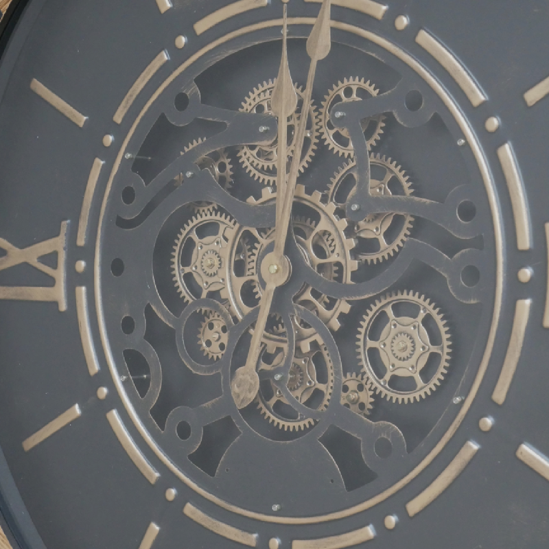Black dial wall clock with visible gear mechanisms, industrial design, 88cm tall, 74cm wide, 9cm deep, 7.3kg in weight.