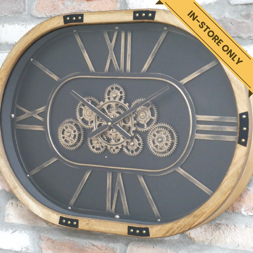Clock with cogs oval wood border black dial gold numbers. This cog clock has moving clock parts (requires 3X AA batteries, not included), 50cm high, 68cm wide, 8cm deep, weighs 5.6kgs.