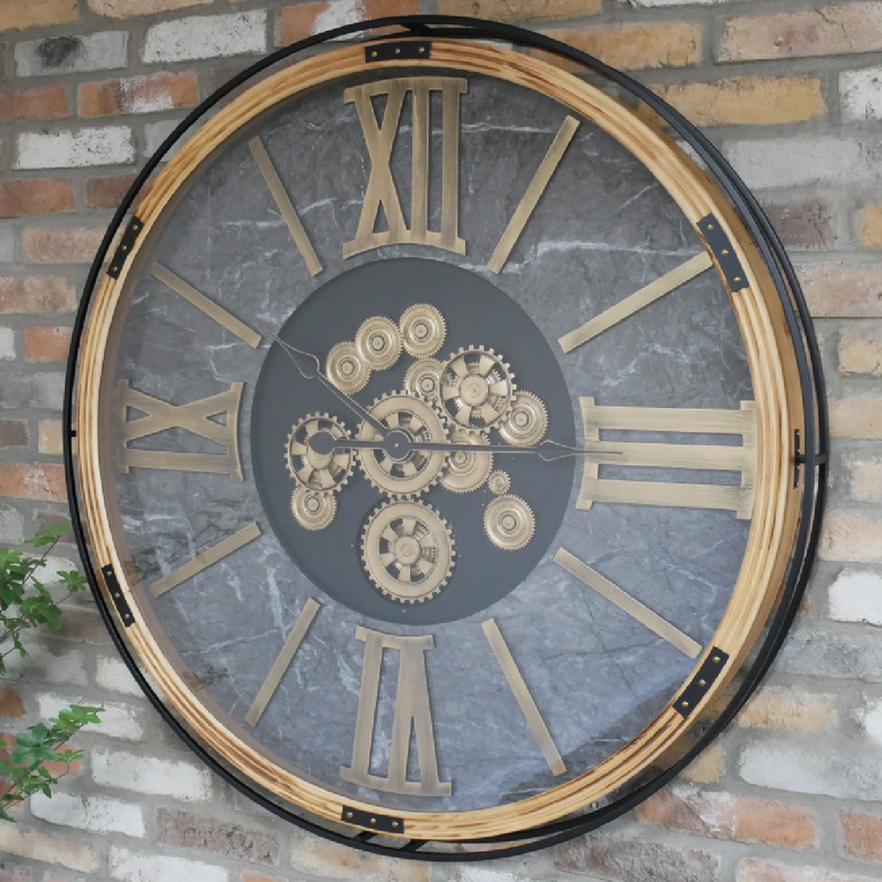Statement wall clock with working mechanical cogs, 112cm tall by 112cm wide by 9cm deep, 26kg; requires 3 AA batteries (not included) for time and movement functions.