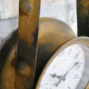 Stylish industrial-style clock with exposed drive belt design, dimensions 43cm H × 19cm W × 9cm D, weight 0.8kg.