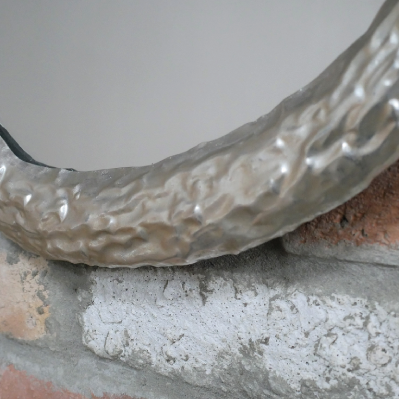 Modern round mirror with a sleek silver frame, dimensions 53cm H x 54cm W x 3cm D, weight 2.76kg.