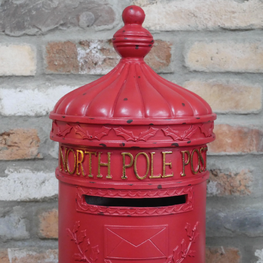 Festive north pole themed postbox, 77cm high, 27cm wide, 27cm deep, weighing 6.5kg, perfect for holiday decor.
