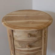 Unfinished teak nightstand with a circular top and natural wood grain, dimensions 72cm H × 35cm W × 35cm D, weight 8kg.