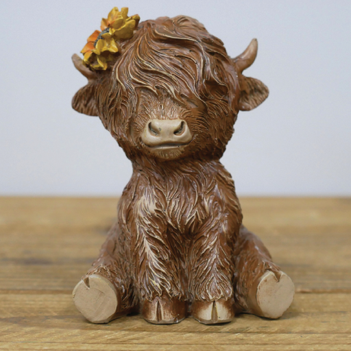 Miniature sitting Highland cow sculpture, 11cm tall by 8cm wide by 8cm deep, lightweight at 0.19kg, perfect for shelves or desks.