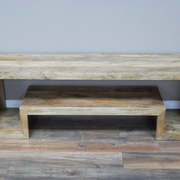 Contemporary mango wood entertainment unit with clean lines, 34.5kg weight, 55cm high and 160cm wide, blends seamlessly into modern or rustic interiors.