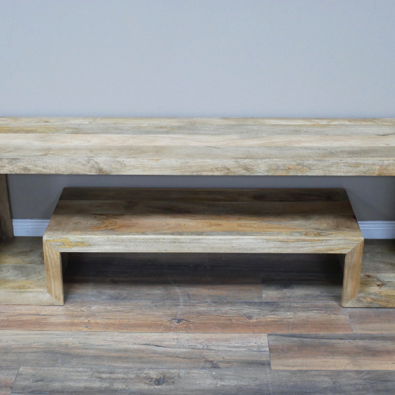 Contemporary mango wood entertainment unit with clean lines, 34.5kg weight, 55cm high and 160cm wide, blends seamlessly into modern or rustic interiors.