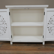Stylish white and gold two-door storage cabinet with intricate carved detailing, 84cm high by 80cm wide by 36cm deep, 14.5kg.