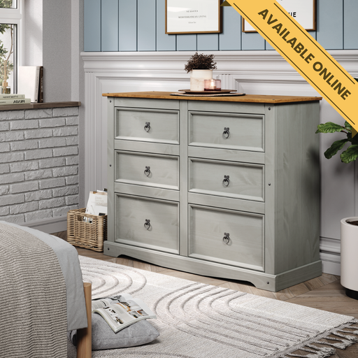 Wide six-drawer chest with a traditional finish, featuring three smaller top drawers and three larger bottom drawers for generous storage; height 83.4cm, width 132.1cm, depth 43cm; weight 37.5kg.