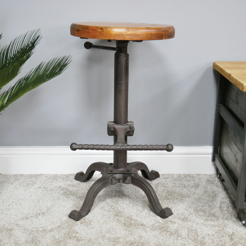 Functional bar-height stool in industrial design with a warm wood seat, 59cm high, 35cm wide, 10.5kg.