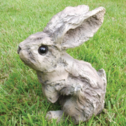 Decorative bunny sculpture with wood-effect texture, perfect for shelves or tabletops, 17 × 10 × 15cm, 0.25kg.