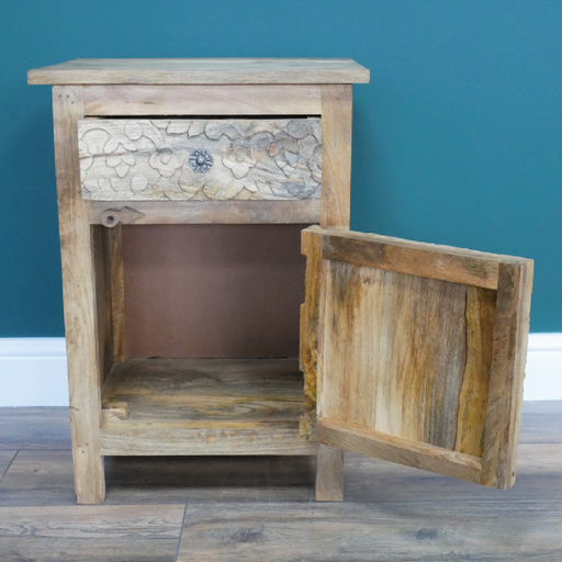 Carved mango wood nightstand featuring floral details, one drawer and one cabinet door, dimensions 60cm H x 42cm W x 33cm D, weight 13.6kg.