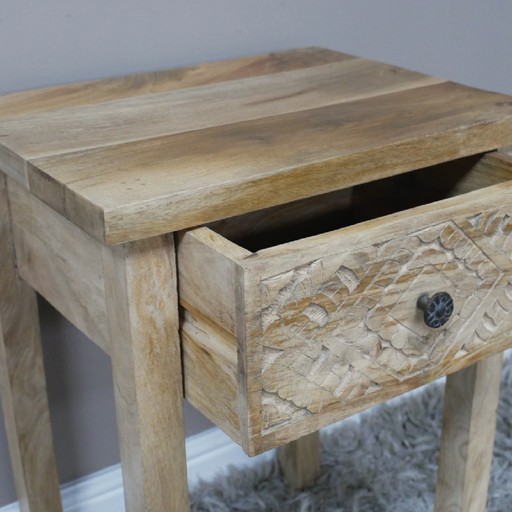 Rustic-modern carved wooden bedside table with a single storage drawer and elevated open legs, 61cm tall by 45cm wide by 35cm deep, 9.1kg.