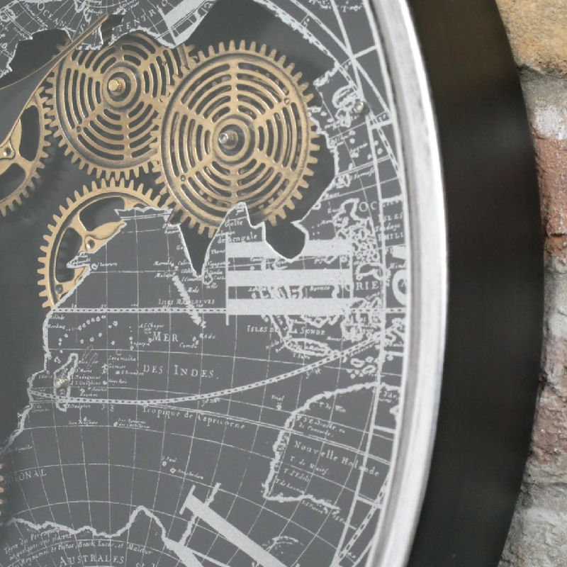 Decorative wall clock with a bold silver-black design and ornamental gold gears, 60cm in diameter and 9cm deep, 5.9kg in weight.