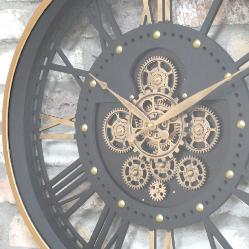 Decorative see-through wall clock featuring a brass frame and functional moving cog mechanisms, dimensions 60cm H × 60cm W × 9cm D, weight 4.8kg; powered by 3 AA batteries (not supplied).