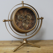 Stylish industrial desk clock with a gold-toned body, black accent elements, and functional-looking cog design, 41 × 36 × 20cm, total weight 2.4kg.