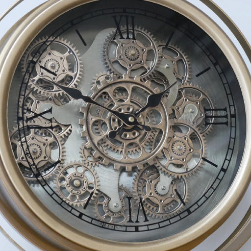 Decorative tripod-style desk clock featuring a gleaming gold finish and visible mechanical cogs, dimensions 57cm H × 48cm W × 23cm D, weight 3kg.