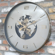 Industrial-style world map clock with silver face, gold lettering, and exposed gears, 60 × 60 × 8cm, total weight 5kg.