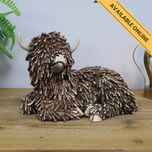 Cow laying ornament. A unique and stylish piece, perfect for modern or rustic interiors, 17cm high, 25cm wide, 15cm deep, weighs 0.83kgs.