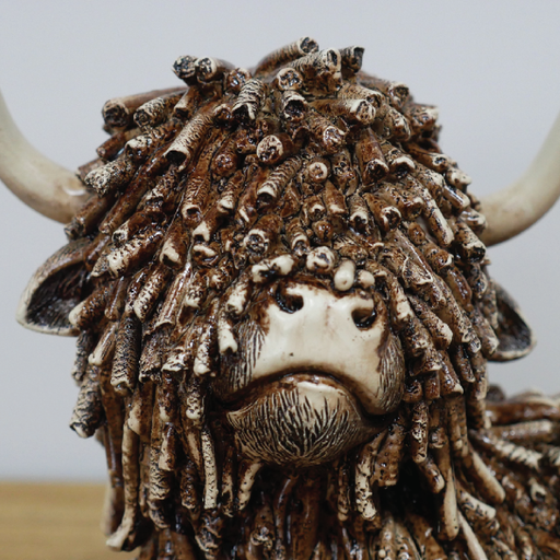 Decorative figurine of a resting cow in a relaxed pose, dimensions 17cm H × 25cm W × 15cm D, weight 0.83kg.