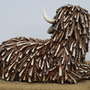 Rustic-style lying cow sculpture with natural or textured finish, 25cm wide by 17cm high by 15cm deep, 0.83kg in weight.