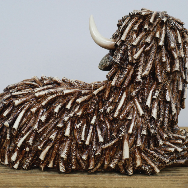 Rustic-style lying cow sculpture with natural or textured finish, 25cm wide by 17cm high by 15cm deep, 0.83kg in weight.