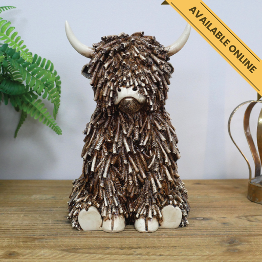 Cow sitting large ornament. A unique and stylish piece, perfect for modern or rustic interiors, 25cm high, 16cm wide, 19cm deep, weighs 1.25kgs.