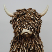 Decorative figurine of a seated cow with smooth or textured finish, dimensions 25cm H × 16cm W × 19cm D, weight 1.25kg.