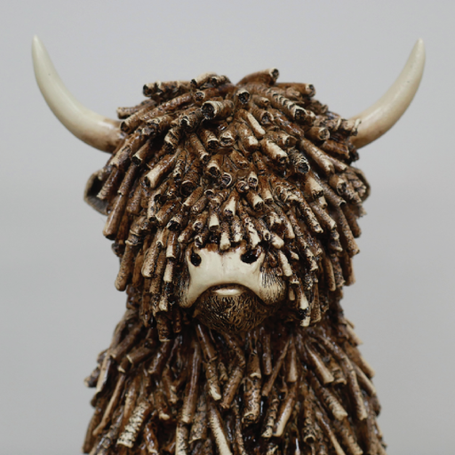 Decorative figurine of a seated cow with smooth or textured finish, dimensions 25cm H × 16cm W × 19cm D, weight 1.25kg.