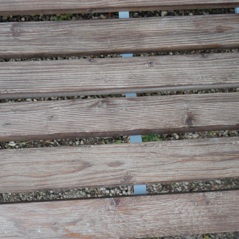 Modern Lincoln bench constructed from iron and fir wood, 98cm tall by 114cm wide by 57cm deep, 13.2kg; suitable for indoor or protected outdoor use.