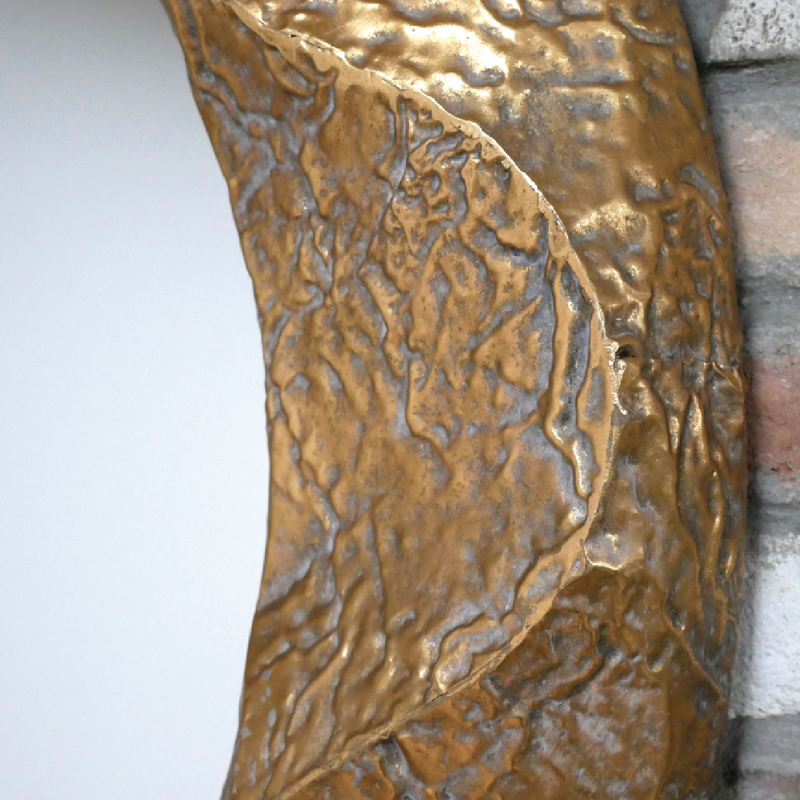Stylish oversized mirror with a hand-hammered gold-effect border, 105cm tall by 105cm wide by 9cm deep, 7.60kg in weight.