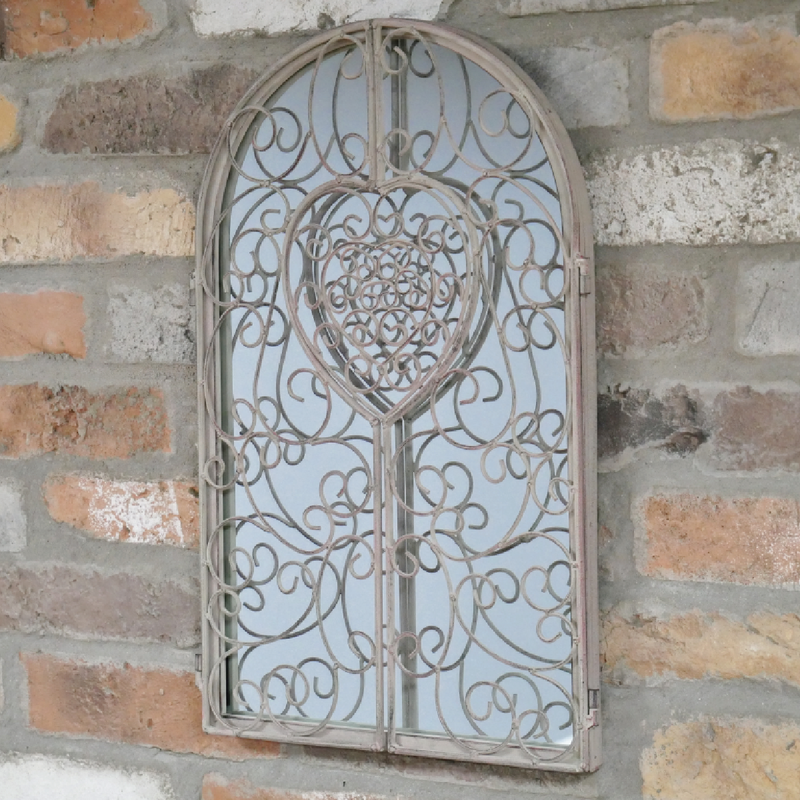 Decorative wall mirror in the shape of a heart, accented with faux shutter detailing, 50cm tall by 32cm wide by 2cm deep, 2kg.
