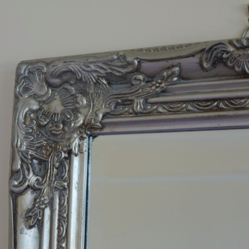Sleek vertical silver-framed mirror, dimensions 132cm H × 42cm W, weight 6kg.