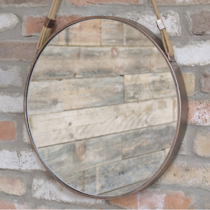 Stylish rose gold wall mirror with a portable hanging strap, 47cm wide by 47cm high by 4cm deep, 2kg in weight.