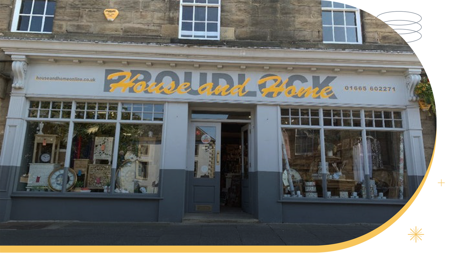Storefront of 'House and Home' with large windows displaying interior decor items.