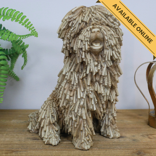 Shaggy dog sitting ornament. A unique and stylish piece, perfect for modern or rustic interiors, 26cm high, 16cm wide, 21cm deep, weighs 1.25kgs.