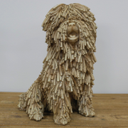 Whimsical seated shaggy dog ornament with a relaxed pose, 26 × 16 × 21cm, total weight 1.25kg.