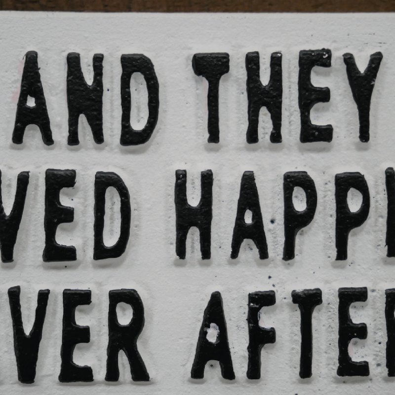 Romantic quote sign featuring "and they lived happily ever after," minimalist design, 17cm wide by 8cm high by 1cm deep, 0.25kg in weight.
