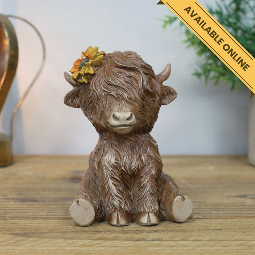 Sitting highland cow ornament. A unique and stylish piece, perfect for modern or rustic interiors, 11cm high, 8cm wide, 8cm deep, weighs 0.19kgs.
