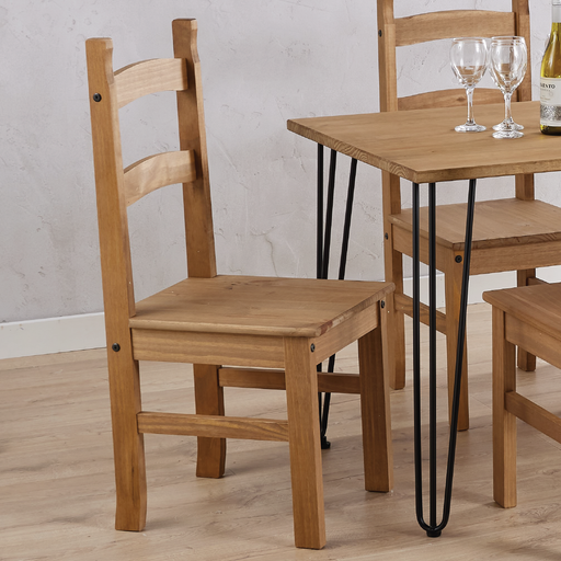 Two robust solid pine chairs offering comfortable seating and farmhouse-style appeal, dimensions 100cm H × 41.5cm W × 48cm D, weight 12.5kg.