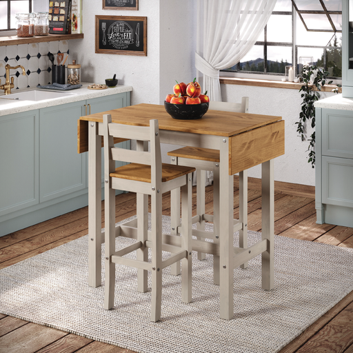 Compact dining set with a high drop-leaf bar table and two stools, ideal for small kitchens or breakfast nooks; dimensions: 100cm H × 60/100cm W × 60cm D; combined weight 29 kilograms.