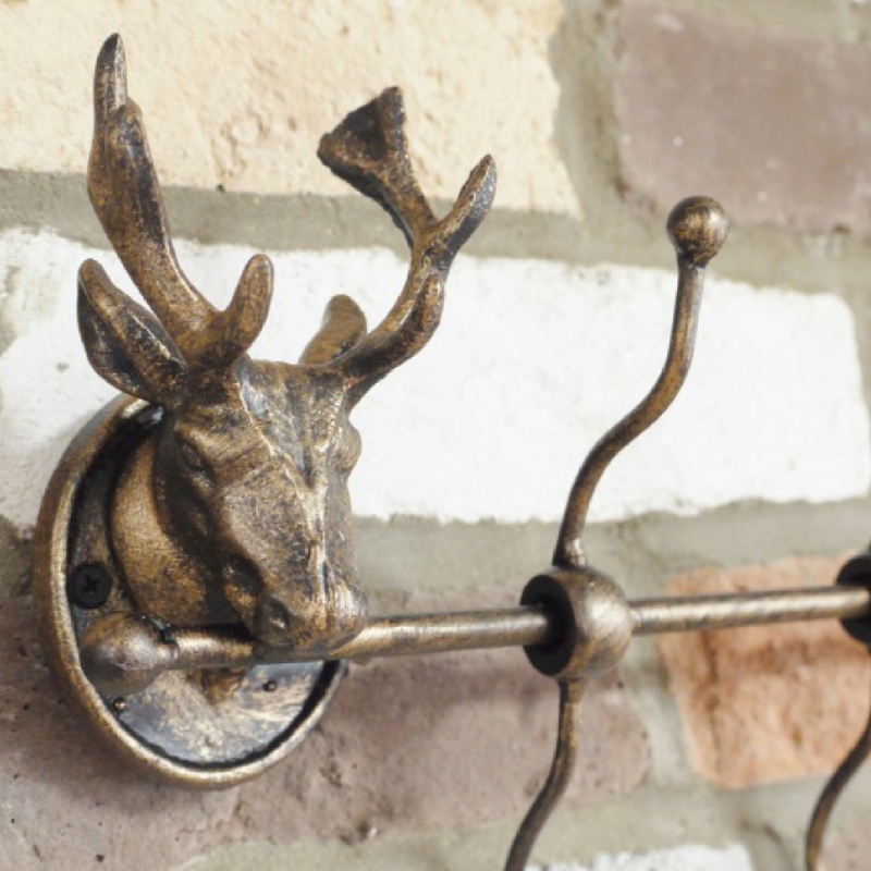 Decorative stag head coat rack featuring several functional hooks, dimensions 22cm H × 50cm W × 9cm D, weight 1.5kg.