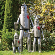 Decorative metal tin man statuette with articulated detailing, 41cm H x 20cm W x 15cm D, weighing 1kg.