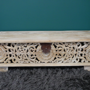 Decorative white storage bench with intricate carvings, 135cm wide and 46cm tall, depth 40cm, 22.60kg, suitable for entryways or living rooms.